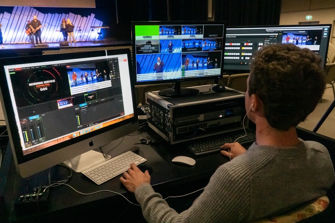 Live broadcast control room with rows of video monitors