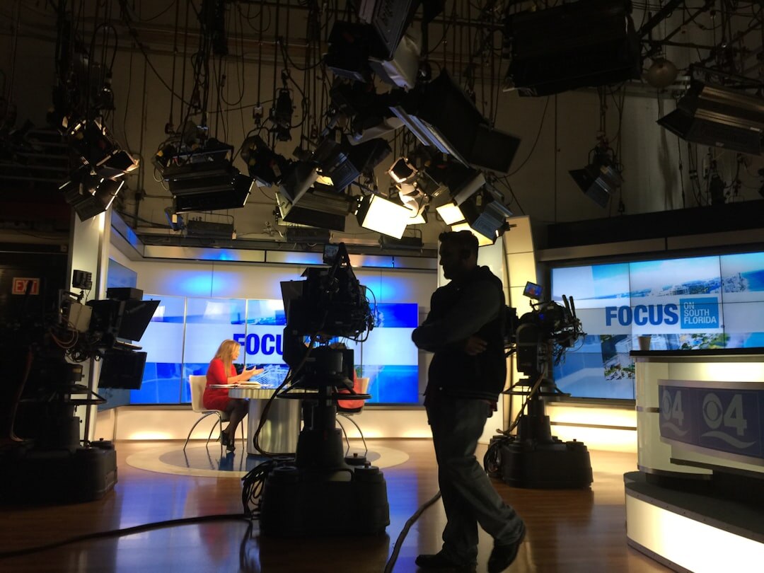 News anchor desk set with cameras and lighting rigs